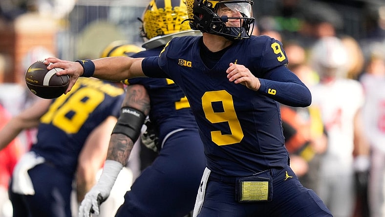 Nov 25, 2023; Ann Arbor, Michigan, USA; Michigan Wolverines quarterback J.J. McCarthy (9) throws during the second half of the NCAA football game against the Ohio State Buckeyes at Michigan Stadium. Ohio State lost 30-24.
