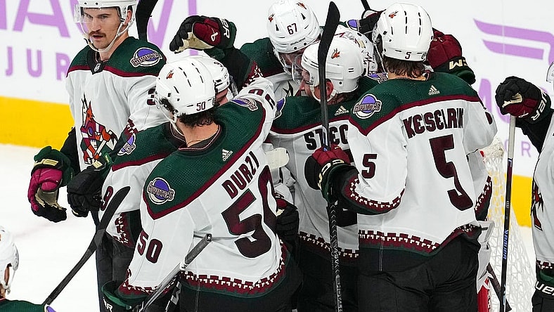 Nov 25, 2023; Las Vegas, Nevada, USA; Arizona Coyotes players celebrate after defeating the Vegas Golden Knights at T-Mobile Arena. Mandatory Credit: Stephen R. Sylvanie-USA TODAY Sports