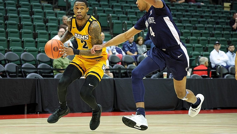 Nov 26, 2023; Kissimmee, FL, USA;  Virginia Commonwealth Rams guard Zeb Jackson (2) drives to the basket past Penn State Nittany Lions forward Puff Johnson (4) in the first half during the ESPN Invitational Events tournament seventh place game at State Farm Field House. Mandatory Credit: Nathan Ray Seebeck-USA TODAY Sports