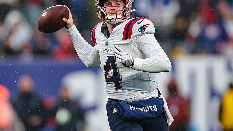 Nov 26, 2023; East Rutherford, New Jersey, USA; New England Patriots quarterback Bailey Zappe (4) throws the ball during the second half against the New York Giants at MetLife Stadium. Mandatory Credit: Vincent Carchietta-USA TODAY Sports