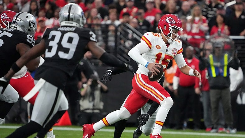 Nov 26, 2023; Paradise, Nevada, USA; Kansas City Chiefs quarterback Patrick Mahomes (15) carries the ball against the Las Vegas Raiders in the first half at Allegiant Stadium. Mandatory Credit: Kirby Lee-USA TODAY Sports