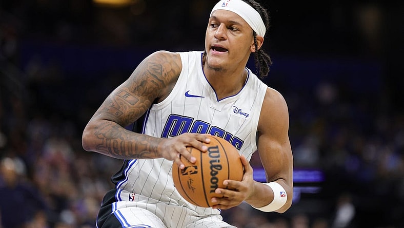 Nov 26, 2023; Orlando, Florida, USA;  Orlando Magic forward Paolo Banchero (5) controls the ball against the Charlotte Hornets in the second quarter at Amway Center. Mandatory Credit: Nathan Ray Seebeck-USA TODAY Sports