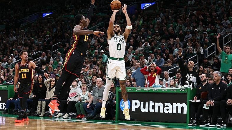 Nov 26, 2023; Boston, Massachusetts, USA; Boston Celtics forward Jayson Tatum (0) shoots against Atlanta Hawks forward Onyeka Okongwu (17) during the second half at TD Garden. Mandatory Credit: Winslow Townson-USA TODAY Sports