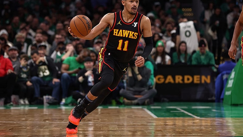 Nov 26, 2023; Boston, Massachusetts, USA; Atlanta Hawks guard Trae Young (11) brings the ball up the court against the Boston Celtics during the second quarter at TD Garden. Mandatory Credit: Winslow Townson-USA TODAY Sports