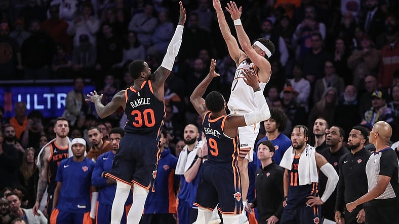 Nov 26, 2023; New York, New York, USA; Phoenix Suns guard Devin Booker (1) takes the game winning three-point shot in the fourth quarter against the New York Knicks at Madison Square Garden. Mandatory Credit: Wendell Cruz-USA TODAY Sports