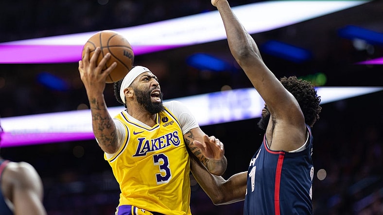 Nov 27, 2023; Philadelphia, Pennsylvania, USA; Los Angeles Lakers forward Anthony Davis (3) drives for a shot against Philadelphia 76ers center Joel Embiid (21) during the second quarter at Wells Fargo Center. Mandatory Credit: Bill Streicher-USA TODAY Sports
