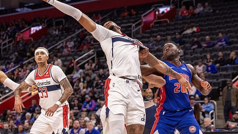 Nov 27, 2023; Detroit, Michigan, USA; Detroit Pistons center Isaiah Stewart (28) and Washington Wizards center Daniel Gafford (21) battle for the ball during the first half at Little Caesars Arena. Mandatory Credit: David Reginek-USA TODAY Sports