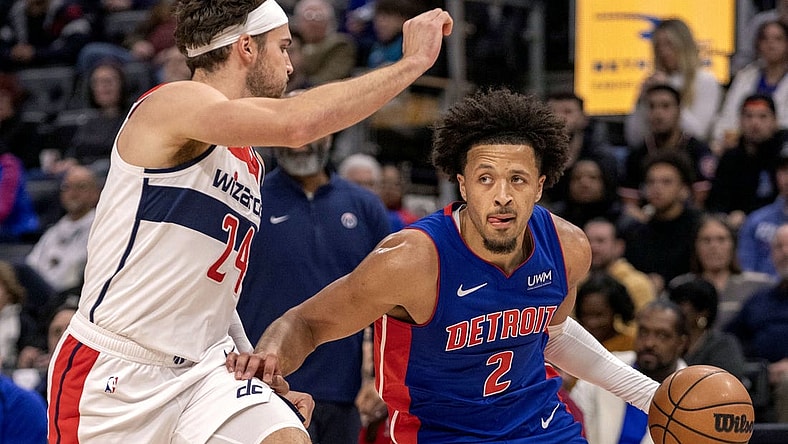 Nov 27, 2023; Detroit, Michigan, USA; Washington Wizards forward Corey Kispert (24) defends against Detroit Pistons guard Cade Cunningham (2) during the in the first half at Little Caesars Arena. Mandatory Credit: David Reginek-USA TODAY Sports