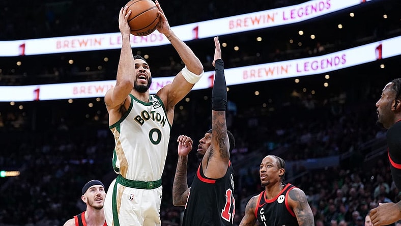 Nov 28, 2023; Boston, Massachusetts, USA; Boston Celtics forward Jayson Tatum (0) shoots against Chicago Bulls forward Torrey Craig (13) in the first quarter at TD Garden. Mandatory Credit: David Butler II-USA TODAY Sports