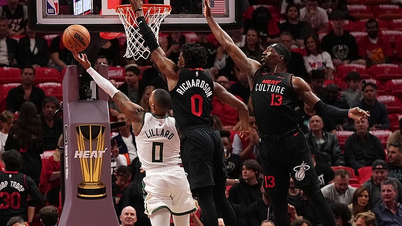 Nov 28, 2023; Miami, Florida, USA; Milwaukee Bucks guard Damian Lillard (0) puts up a shot against Miami Heat guard Josh Richardson (0) during the first half at Kaseya Center. Mandatory Credit: Jasen Vinlove-USA TODAY Sports
