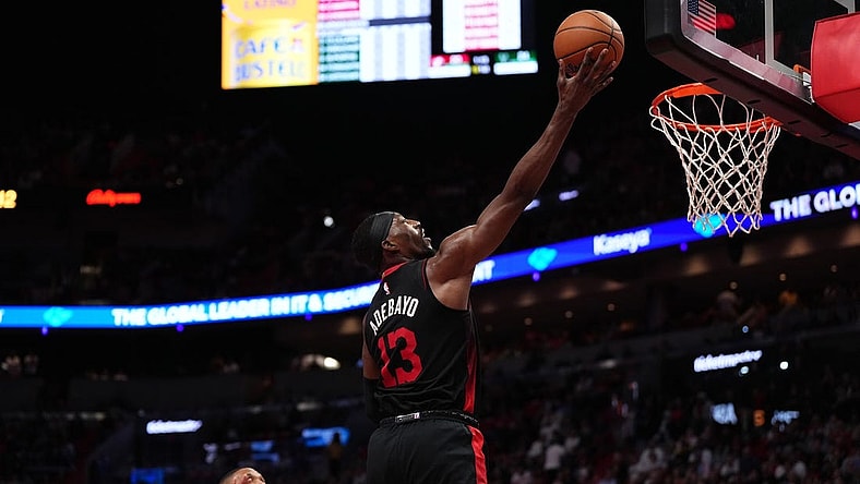 Nov 28, 2023; Miami, Florida, USA; Miami Heat center Bam Adebayo (13) puts up a shot against the Milwaukee Bucks during the first half at Kaseya Center. Mandatory Credit: Jasen Vinlove-USA TODAY Sports