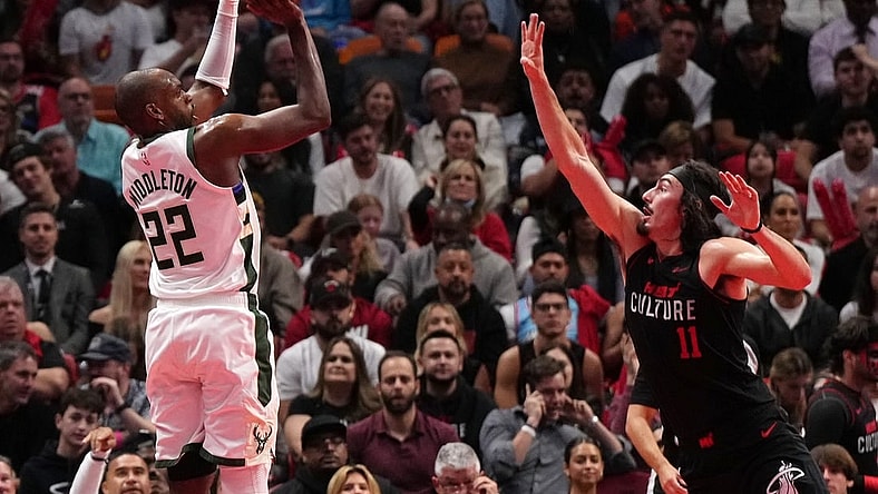 Nov 28, 2023; Miami, Florida, USA; Milwaukee Bucks forward Khris Middleton (22) shoots over Miami Heat guard Jaime Jaquez Jr. (11) during the first half at Kaseya Center. Mandatory Credit: Jasen Vinlove-USA TODAY Sports
