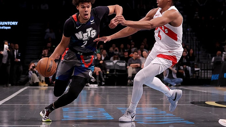 Nov 28, 2023; Brooklyn, New York, USA; Brooklyn Nets forward Cameron Johnson (2) controls the ball against Toronto Raptors forward Scottie Barnes (4) during the second quarter at Barclays Center. Mandatory Credit: Brad Penner-USA TODAY Sports