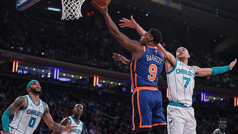 Nov 28, 2023; New York, New York, USA; New York Knicks guard RJ Barrett (9) drives to the basket as Charlotte Hornets guard Bryce McGowens (7) and forward Miles Bridges (0) defend during the first half at Madison Square Garden. Mandatory Credit: Vincent Carchietta-USA TODAY Sports