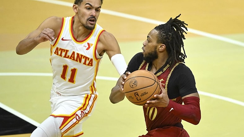 Nov 28, 2023; Cleveland, Ohio, USA; Atlanta Hawks guard Trae Young (11) defends Cleveland Cavaliers guard Darius Garland (10) in the fourth quarter at Rocket Mortgage FieldHouse. Mandatory Credit: David Richard-USA TODAY Sports