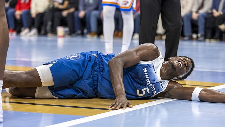 Nov 28, 2023; Minneapolis, Minnesota, USA; Minnesota Timberwolves guard Anthony Edwards (5) reacts after landing on the floor against the Oklahoma City Thunder in the second half at Target Center. Mandatory Credit: Jesse Johnson-USA TODAY Sports