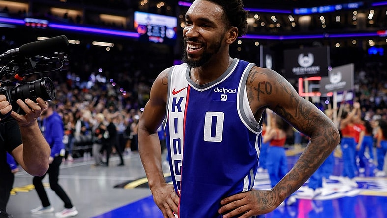 Nov 28, 2023; Sacramento, California, USA; Sacramento Kings guard Malik Monk (0) is interviewed after a game against the Golden State Warriors at Golden 1 Center. Mandatory Credit: Sergio Estrada-USA TODAY Sports