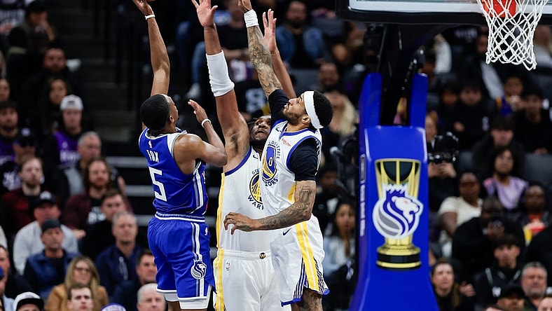 Nov 28, 2023; Sacramento, California, USA; Sacramento Kings guard De'Aaron Fox (5) shoots over Golden State Warriors guard Gary Payton II (0) during the third  quarter at Golden 1 Center. Mandatory Credit: Sergio Estrada-USA TODAY Sports