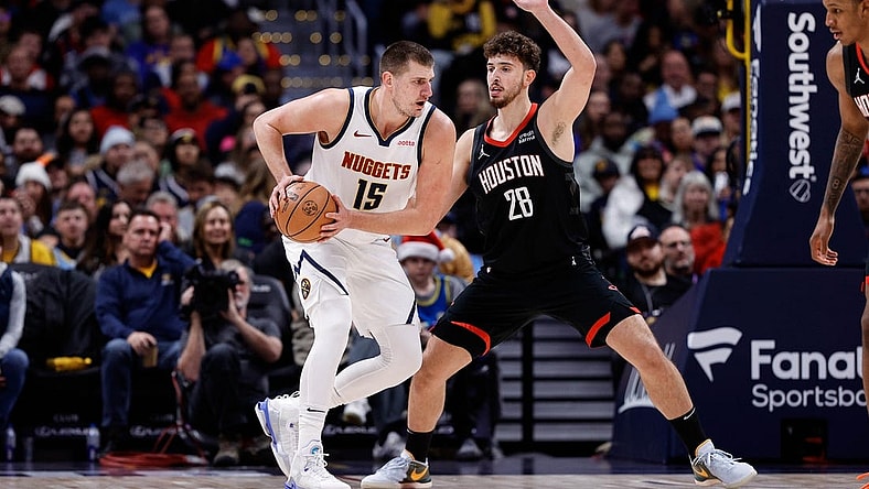 Nov 29, 2023; Denver, Colorado, USA; Denver Nuggets center Nikola Jokic (15) controls the ball as Houston Rockets center Alperen Sengun (28) guards in the second quarter at Ball Arena. Mandatory Credit: Isaiah J. Downing-USA TODAY Sports
