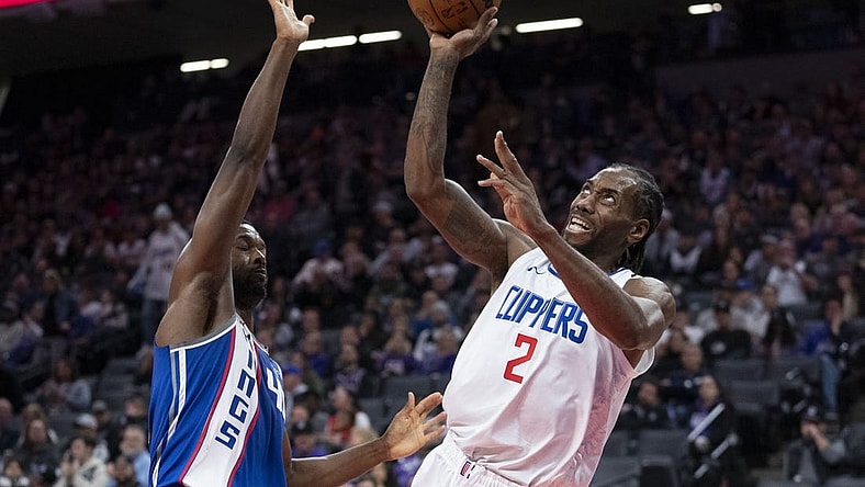 November 29, 2023; Sacramento, California, USA; LA Clippers forward Kawhi Leonard (2) shoots the basketball against Sacramento Kings forward Harrison Barnes (40) during the third quarter at Golden 1 Center. Mandatory Credit: Kyle Terada-USA TODAY Sports