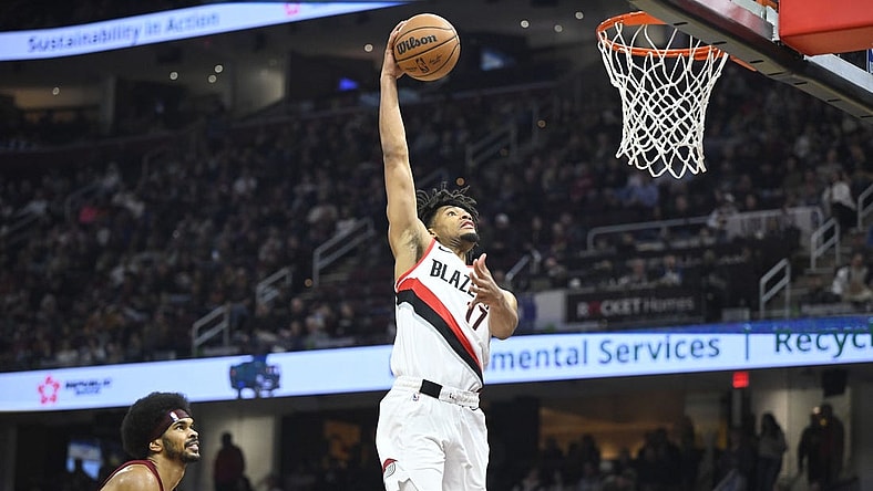 Nov 30, 2023; Cleveland, Ohio, USA; Portland Trail Blazers guard Shaedon Sharpe (17) dunks beside Cleveland Cavaliers center Jarrett Allen (31) in the second quarter at Rocket Mortgage FieldHouse. Mandatory Credit: David Richard-USA TODAY Sports