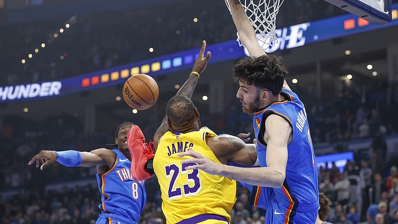Nov 30, 2023; Oklahoma City, Oklahoma, USA; Los Angeles Lakers forward LeBron James (23), Oklahoma City Thunder forward Chet Holmgren (7) and forward Jalen Williams (8) fight for a rebound during the first quarter at Paycom Center. Mandatory Credit: Alonzo Adams-USA TODAY Sports