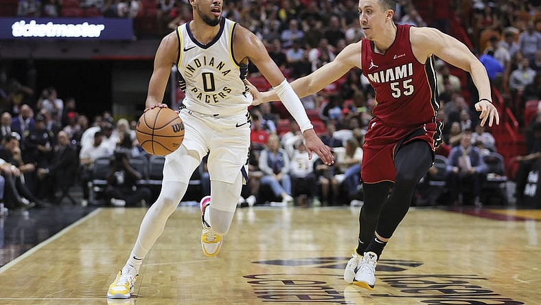 Nov 30, 2023; Miami, Florida, USA; Indiana Pacers guard Tyrese Haliburton (0) drives to the basket against Miami Heat forward Duncan Robinson (55) during the second quarter at Kaseya Center. Mandatory Credit: Sam Navarro-USA TODAY Sports