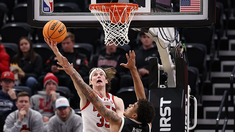 Nov 30, 2023; Salt Lake City, Utah, USA; Utah Utes center Branden Carlson (35) shoots the ball over Hawaii Warriors forward Justin McKoy (1) during the first half at Delta Center. Mandatory Credit: Rob Gray-USA TODAY Sports
