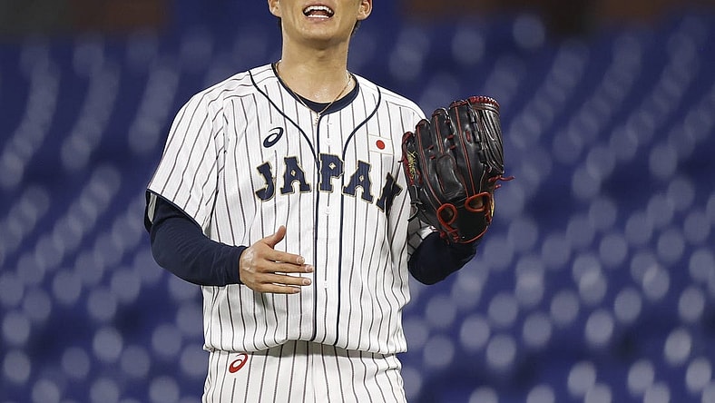 Aug 4, 2021; Yokohama, Japan; Team Japan pitcher Yoshinobu Yamamoto (17) reacts against Korea in a baseball semifinal match during the Tokyo 2020 Olympic Summer Games at Yokohama Baseball Stadium. Mandatory Credit: Yukihito Taguchi-USA TODAY Sports