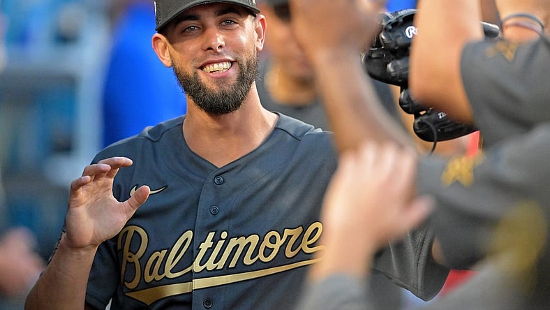 Jul 19, 2022; Los Angeles, California, USA; American League relief pitcher Jorge Lopez (48) of the Baltimore Orioles smiles as he gets high fives in the dugout after pitching against the National League during the seventh inning of the 2022 MLB All Star Game at Dodger Stadium. Mandatory Credit: Jayne Kamin-Oncea-USA TODAY Sports