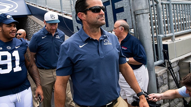 Penn State football defensive coordinator Manny Diaz walks onto the turf with other members of the team during football media day at Beaver Stadium on Saturday, August 6, 2022, in State College.

Hes Dr 080622 Psumedia