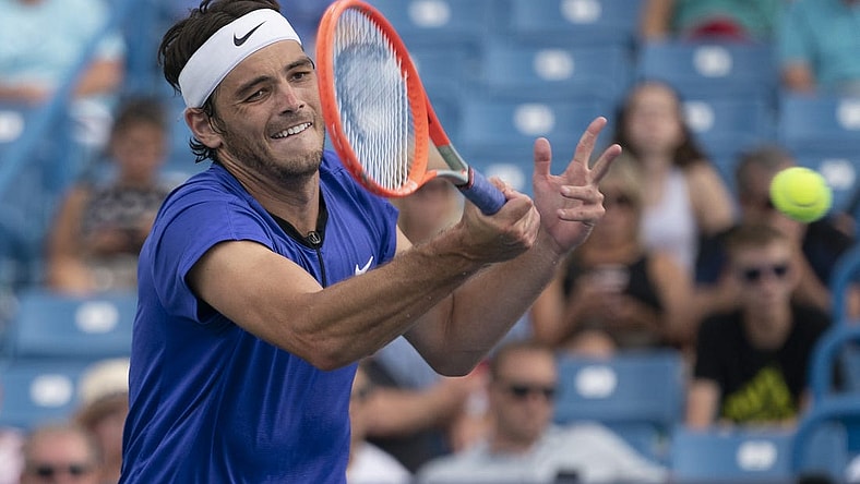Aug 19, 2022; Cincinnati, OH, USA; Taylor Fritz (USA) returns a shot during his match against Daniil Medvedev (RUS) at the Western & Southern Open at the Lindner Family Tennis Center. Mandatory Credit: Susan Mullane-USA TODAY Sports