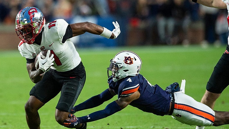 Western Kentucky Hilltoppers wide receiver Malachi Corley (11) turns up field after making a catch as Auburn Tigers take on Western Kentucky Hilltoppers at Jordan-Hare Stadium in Auburn, Ala., on Saturday, Nov. 19, 2022. Auburn Tigers and Western Kentucky Hilltoppers are tied 17-17 at halftime.