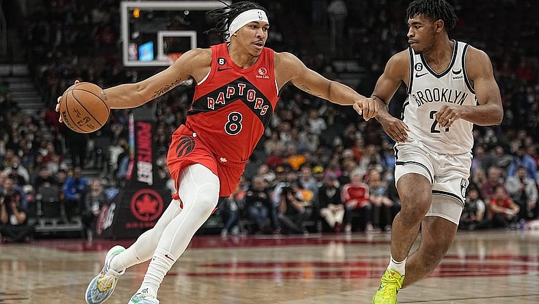 Nov 23, 2022; Toronto, Ontario, CAN; Toronto Raptors guard Ron Harper Jr. (8) drives to the net against b25during the second half at Scotiabank Arena. Mandatory Credit: John E. Sokolowski-USA TODAY Sports