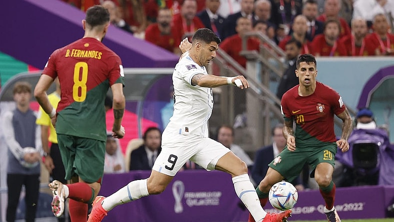 Nov 28, 2022; Lusail, Qatar; Uruguay forward Luis Suarez (9) shoots on goal against Portugal during the second half of the group stage match in the 2022 World Cup at Lusail Stadium. Mandatory Credit: Yukihito Taguchi-USA TODAY Sports
