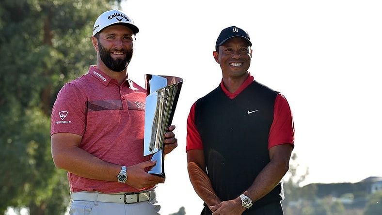 Feb 19, 2023; Pacific Palisades, California, USA; Jon Rahm poses for photos with Tiger Woods following his victory in the final round of The Genesis Invitational golf tournament. Mandatory Credit: Gary A. Vasquez-USA TODAY Sports