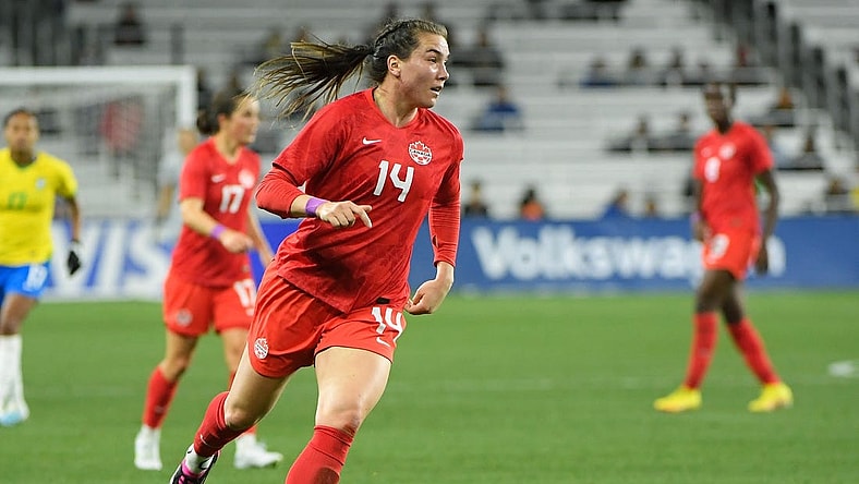 Feb 19, 2023; Nashville, Tennessee, USA;  Canada defender Vanessa Gilles (14) dribbles the ball against Canada during the first half at Geodis Park. Mandatory Credit: Steve Roberts-USA TODAY Sports