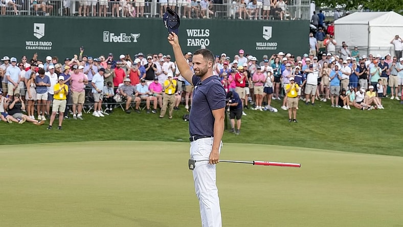 May 7, 2023; Charlotte, North Carolina, USA; Wyndham Clark celebrates to the gallery after his win during the final round of the Wells Fargo Championship golf tournament. Mandatory Credit: Jim Dedmon-USA TODAY Sports