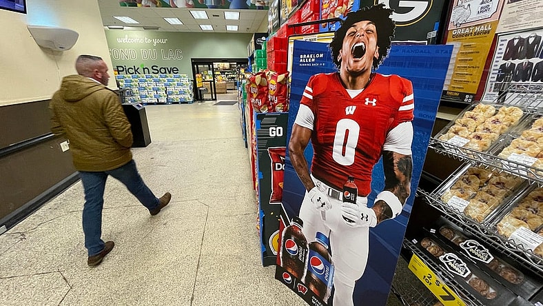 A promotional  display for Pepsi featuring Wisconsin running back Braelon Allen is shown in November 2022 at a Pick 'n Save store in Fond du Lac, Wis. When the NCAA enacted Name Image Likeness (NIL) legislation in July 2021 it gave athletes the opportunity to earn money off endorsements as well as use their name in support of causes important to them.