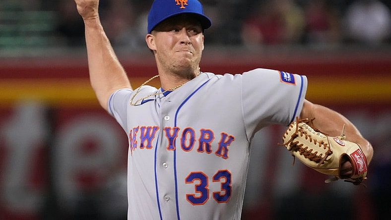 Jul 6, 2023; Phoenix, Arizona, USA; New York Mets relief pitcher Trevor Gott (33) pitches against the Arizona Diamondbacks during the ninth inning at Chase Field. Mandatory Credit: Joe Camporeale-USA TODAY Sports