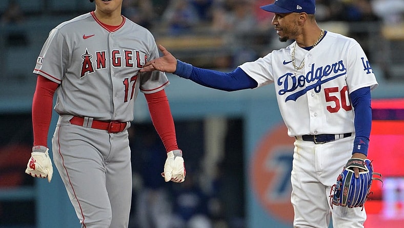 Jul 7, 2023; Los Angeles, California, USA; Los Angeles Angels starting pitcher Shohei Ohtani (17) and Los Angeles Dodgers right fielder Mookie Betts (50) talk while at second base during a play review in the fourth inning at Dodger Stadium. Mandatory Credit: Jayne Kamin-Oncea-USA TODAY Sports