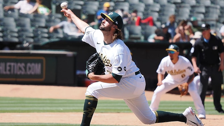 Jul 23, 2023; Oakland, California, USA; Oakland Athletics   relief pitcher Chad Smith (3) pitches the ball against the Houston Astros during the eighth inning at Oakland-Alameda County Coliseum. Mandatory Credit: Kelley L Cox-USA TODAY Sports
