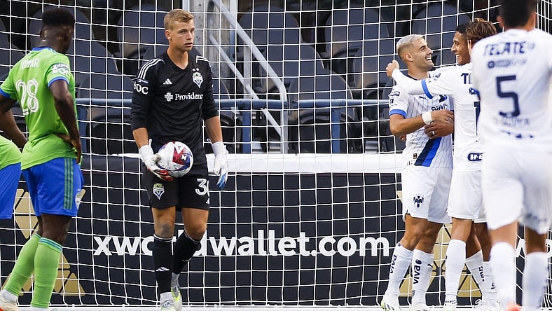 Jul 30, 2023; Seattle, WA, USA; Monterrey forward German Berterame (9, second from right) hugs defender Luis Romo (27) after scoring a goal against Seattle Sounders FC goalkeeper Stefan Cleveland (30) during the second half at Lumen Filed. Mandatory Credit: Joe Nicholson-USA TODAY Sports
