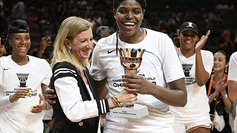 Aug 15, 2023; Las Vegas, Nevada, USA; WNBA Commissioner Cathy Engelbert hands New York Liberty forward Jonquel Jones the MVP trophy for the Commissioner   s Cup Championship game after defeating the Las Vegas Aces at Michelob Ultra Arena. Mandatory Credit: Candice Ward-USA TODAY Sports