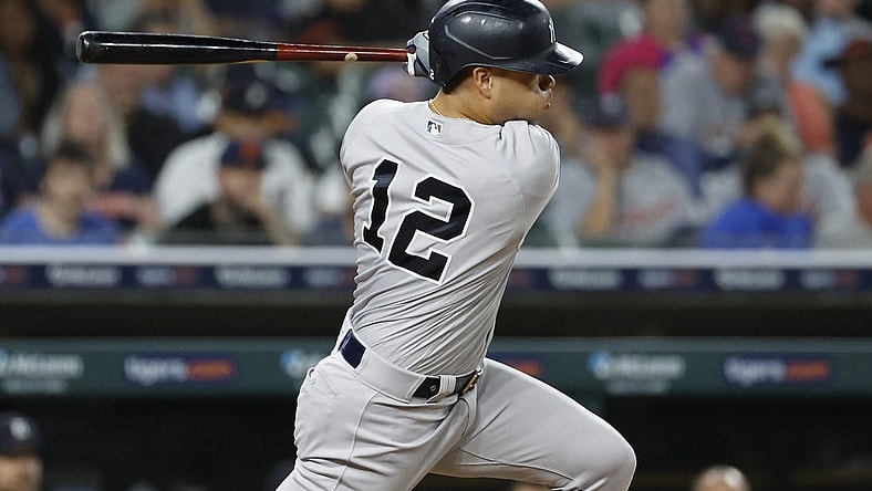 Aug 28, 2023; Detroit, Michigan, USA;  New York Yankees center fielder Isiah Kiner-Falefa (12) hits a single in the eighth inning against the Detroit Tigers at Comerica Park. Mandatory Credit: Rick Osentoski-USA TODAY Sports