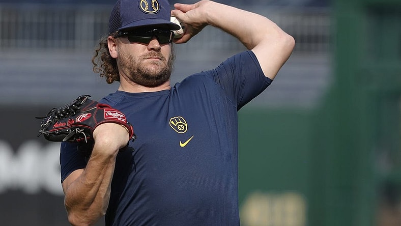 Sep 4, 2023; Pittsburgh, Pennsylvania, USA; Milwaukee Brewers relief pitcher Andrew Chafin (32) throws in the outfield before the game against the Pittsburgh Pirates at PNC Park. Mandatory Credit: Charles LeClaire-USA TODAY Sports