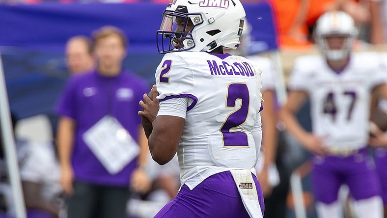 Sept 9, 2023; Charlottesville, Virginia, USA; James Madison Dukes quarterback Jordan McCloud (2) looks for a pass to an open player during the second half of the game against the Virginia Cavaliers at Scott Stadium. Mandatory Credit: Hannah Pajewski-USA TODAY Sports