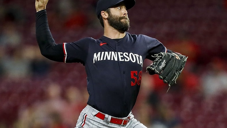 Sep 19, 2023; Cincinnati, Ohio, USA; Minnesota Twins relief pitcher Dylan Floro (58) pitches against the Cincinnati Reds in the ninth inning at Great American Ball Park. Mandatory Credit: Katie Stratman-USA TODAY Sports
