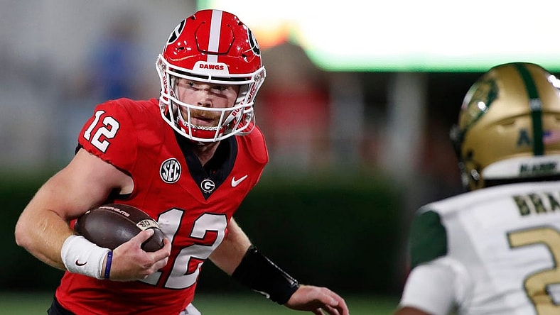 Georgia quarterback Brock Vandagriff (12) runs the ball during the second half of a NCAA college football game against UAB in Athens, Ga., on Saturday, Sept. 23, 2023.