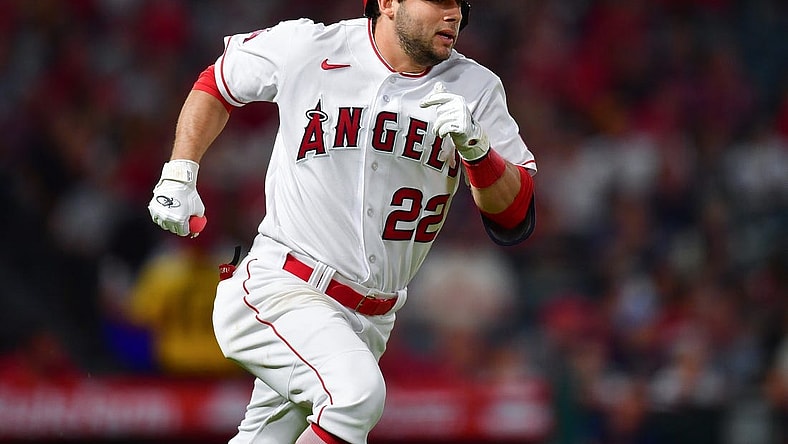 Sep 26, 2023; Anaheim, California, USA; Los Angeles Angels second baseman David Fletcher (22) runs after hitting a single against the Texas Rangers during the fifth inning at Angel Stadium. Mandatory Credit: Gary A. Vasquez-USA TODAY Sports